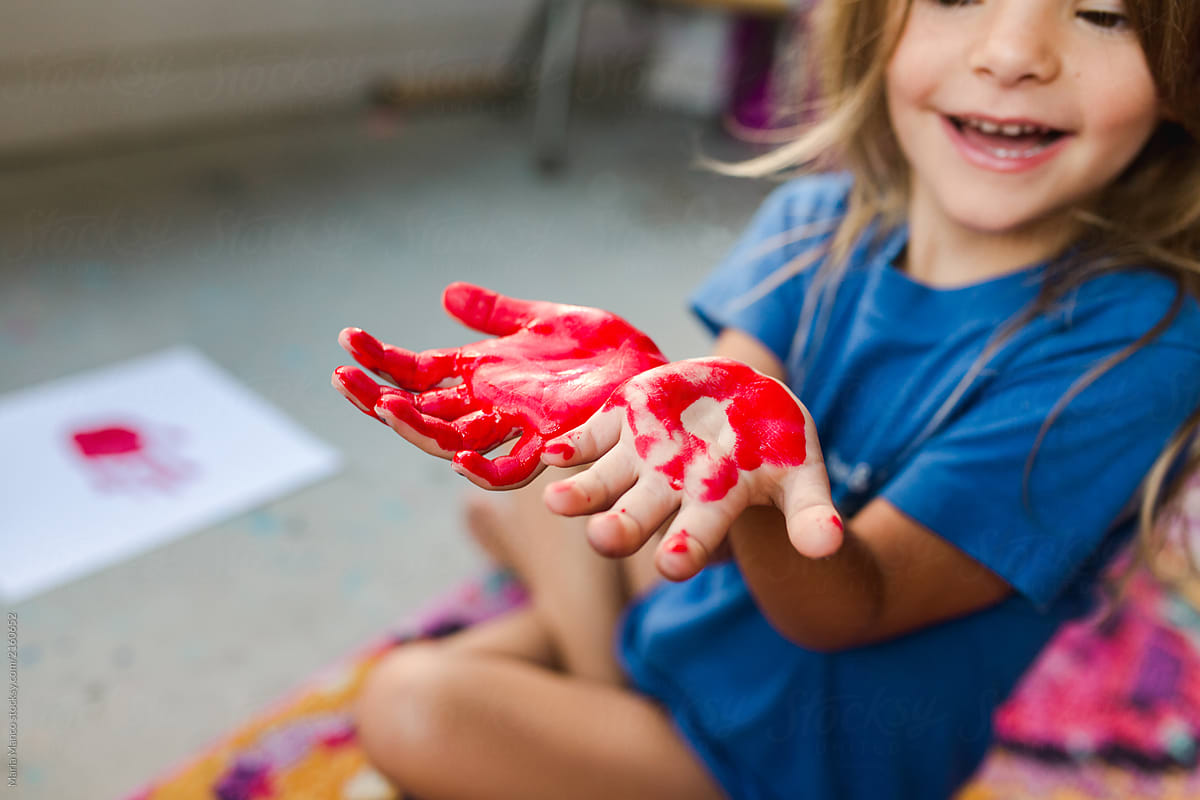 girl with painted red hand
