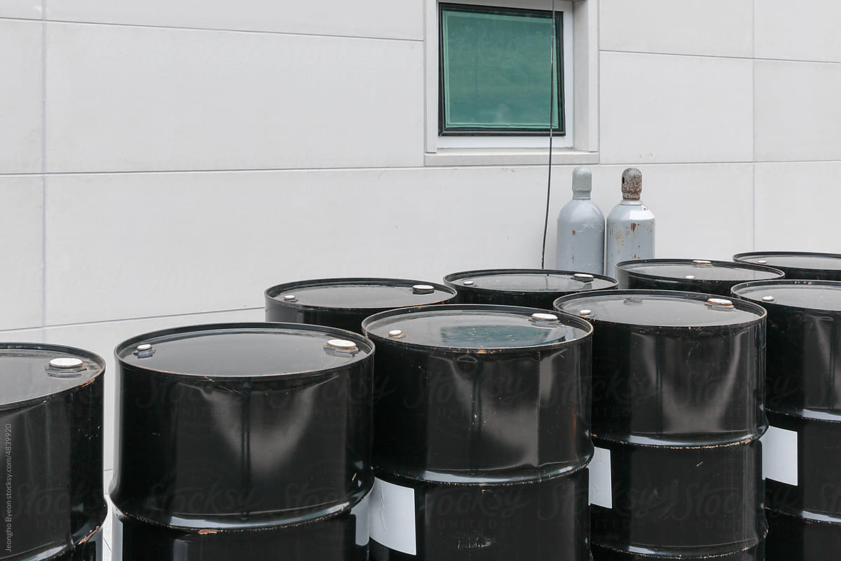 Close-up of black drums in the factory.