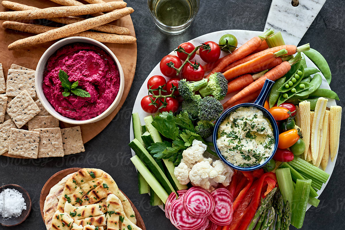 Party platter with different dips and vegetables