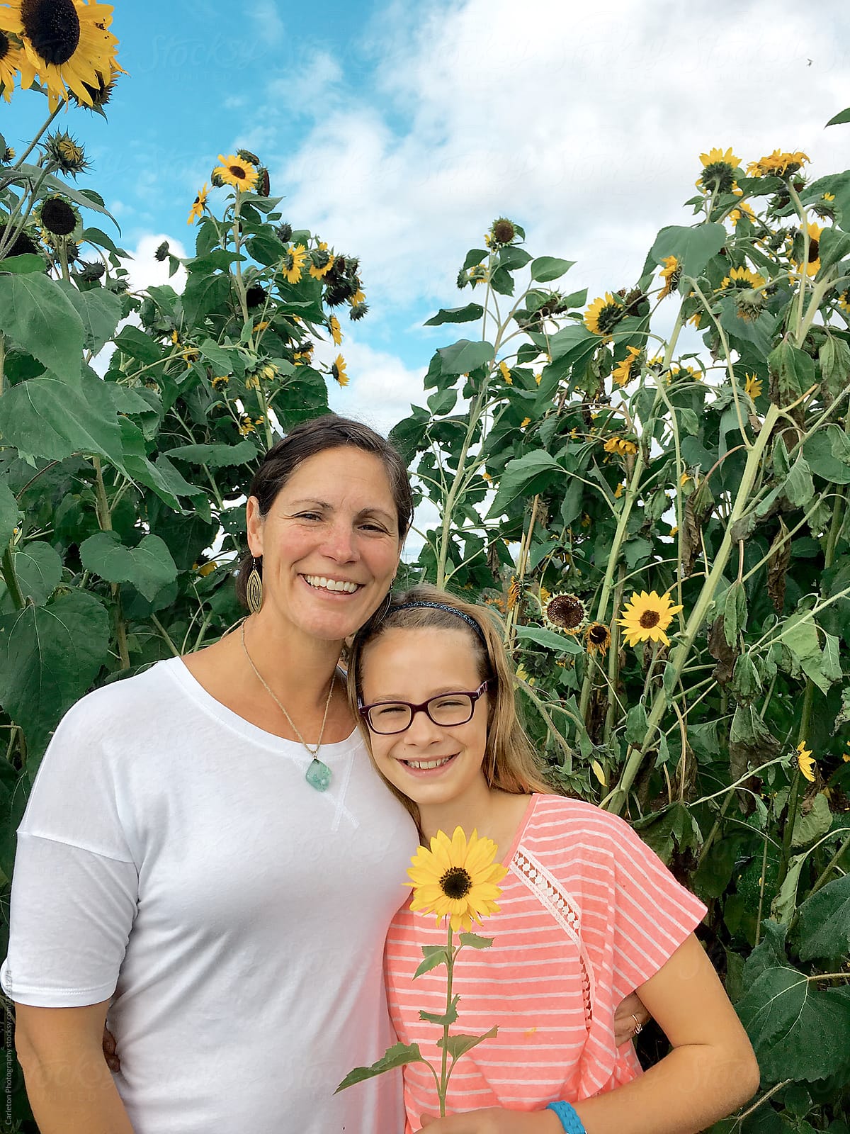 Mother and daughter with sunflowers
