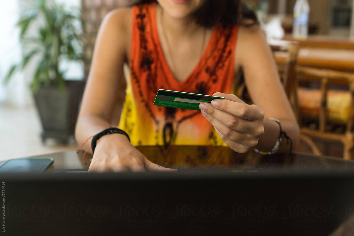 woman shopping online with a credit card