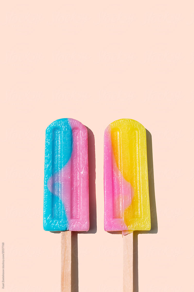 Two icecream lollies on a wooden stick
