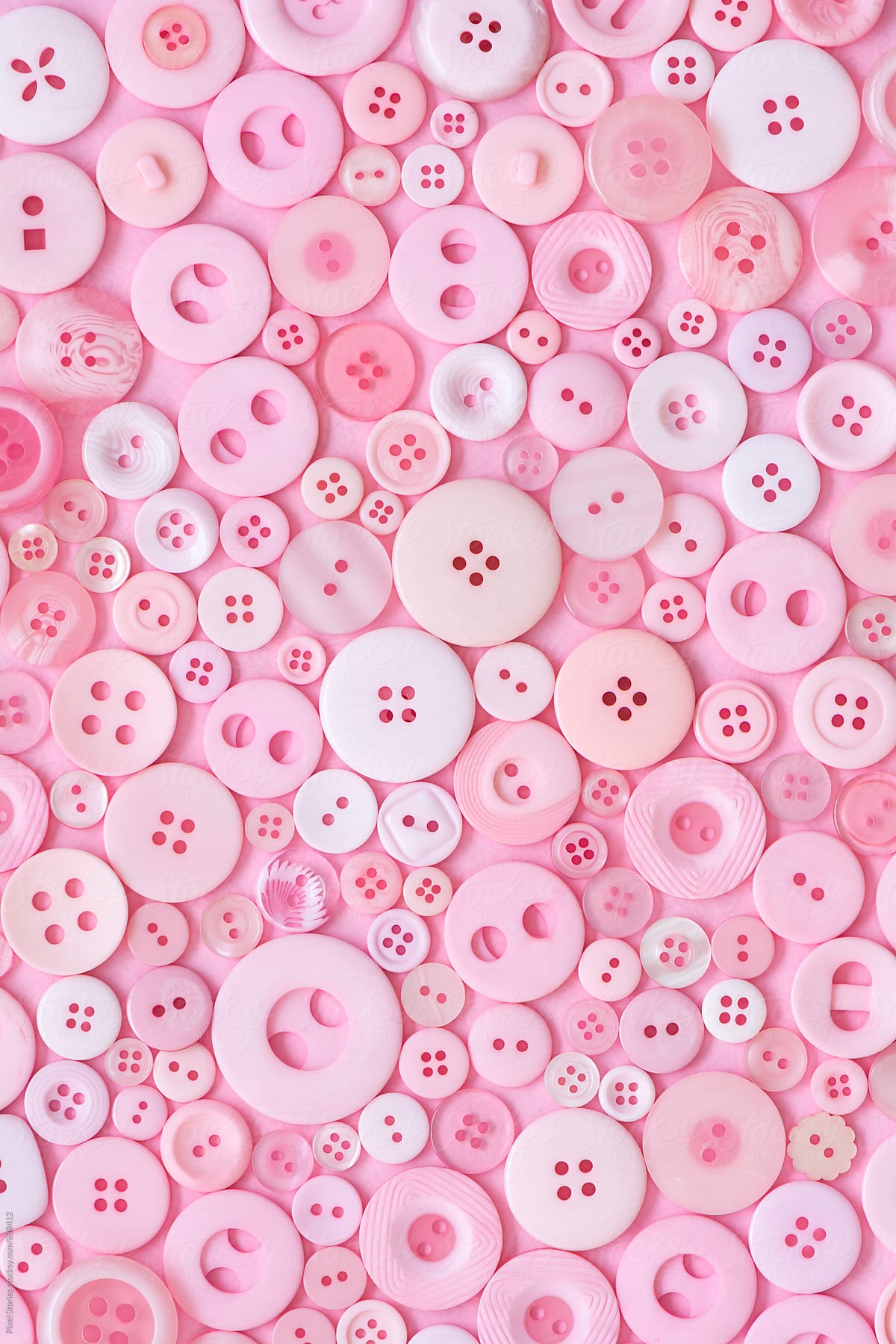 Pink Buttons Background» del colaborador de Stocksy «Pixel Stories