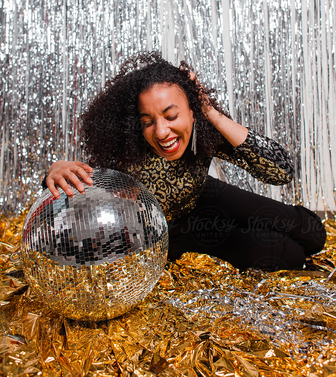 woman laughing with disco ball