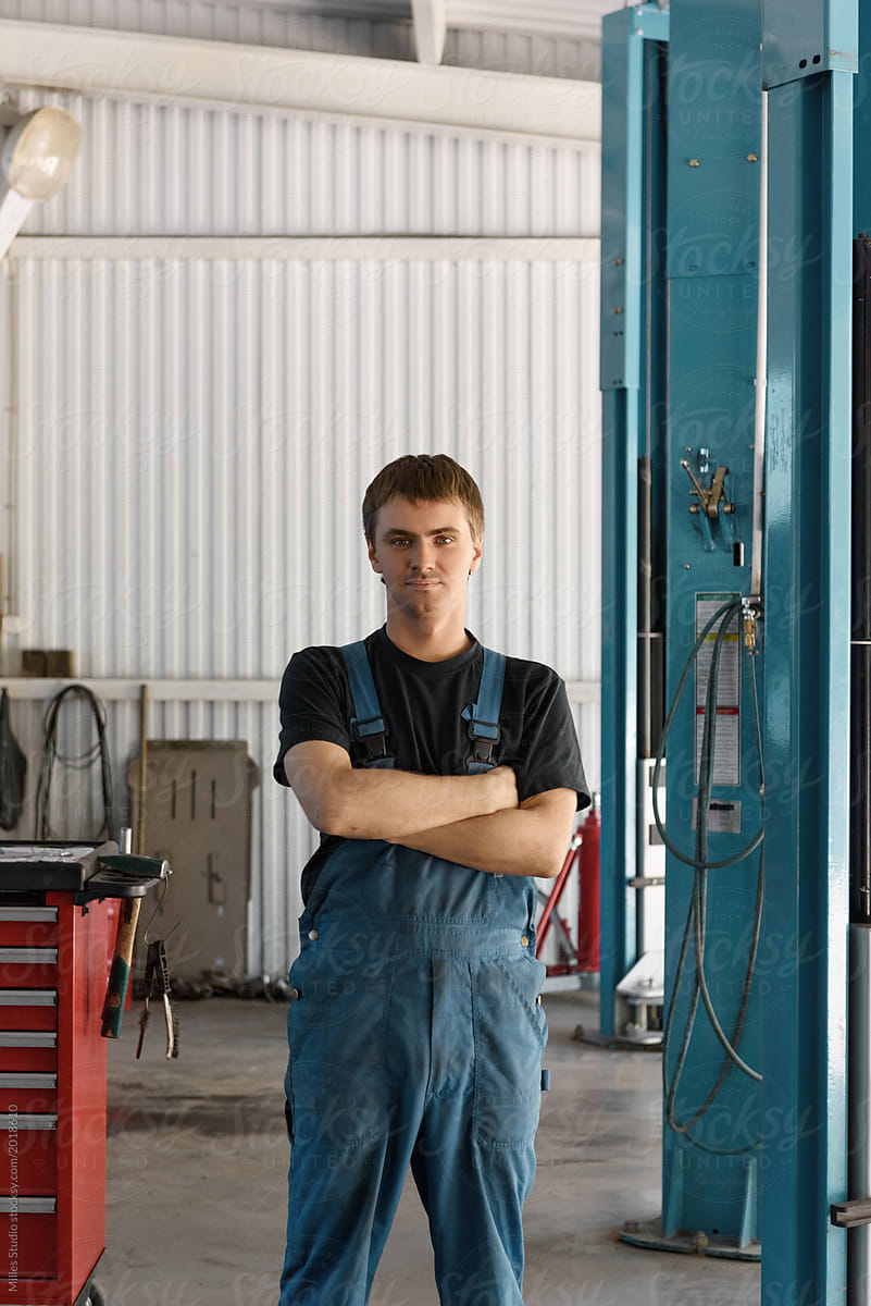 Man in working overall in garage