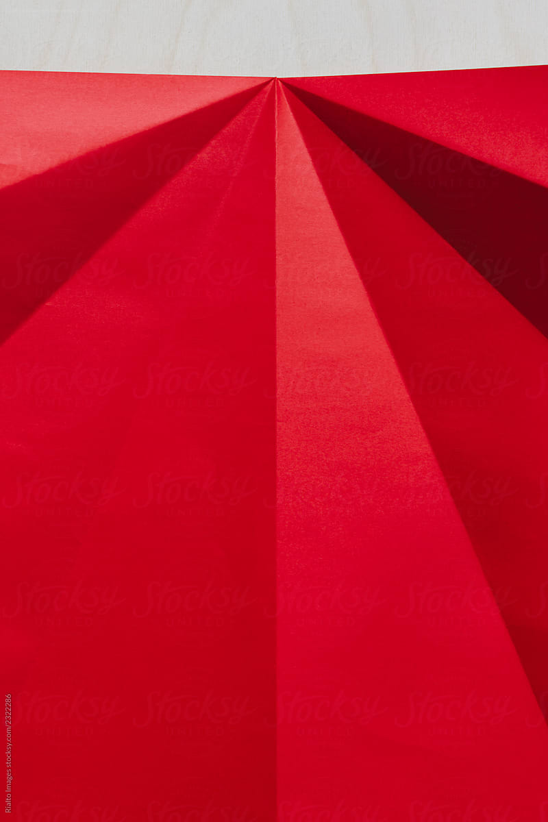Close Up Of Folded Red Origami Paper by Stocksy Contributor