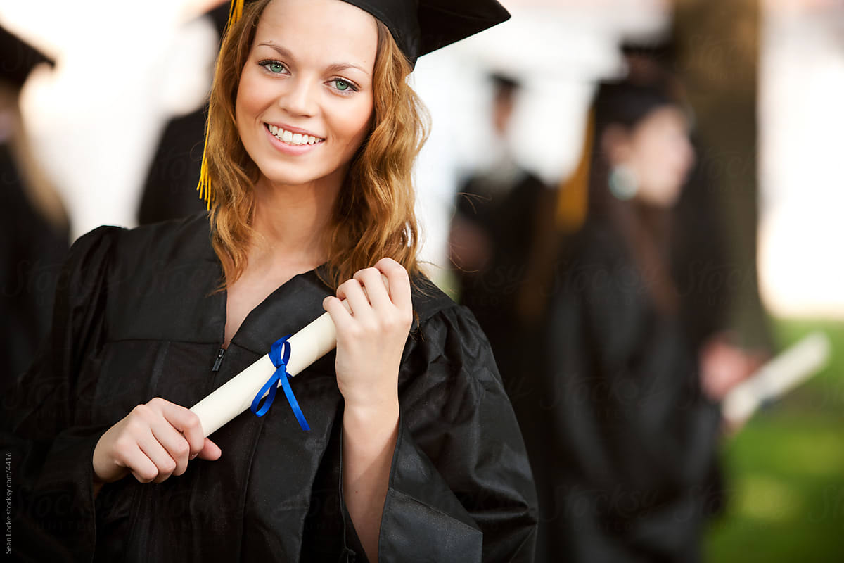 Graduation: Pretty Graduate Holding Diploma