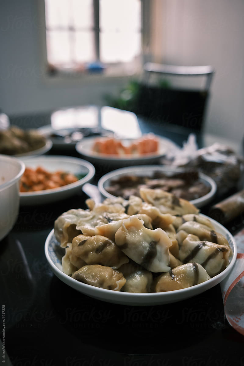 Closeup Of Chinese Dumplings And Various Other Dishes At Home.
