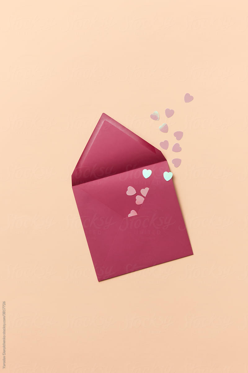 Pink envelope with paper hearts