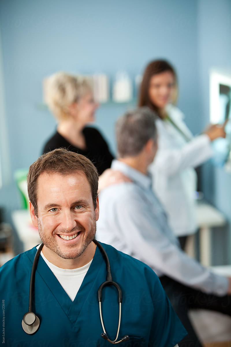 Exam Room: Male Nurse with Patients Behind