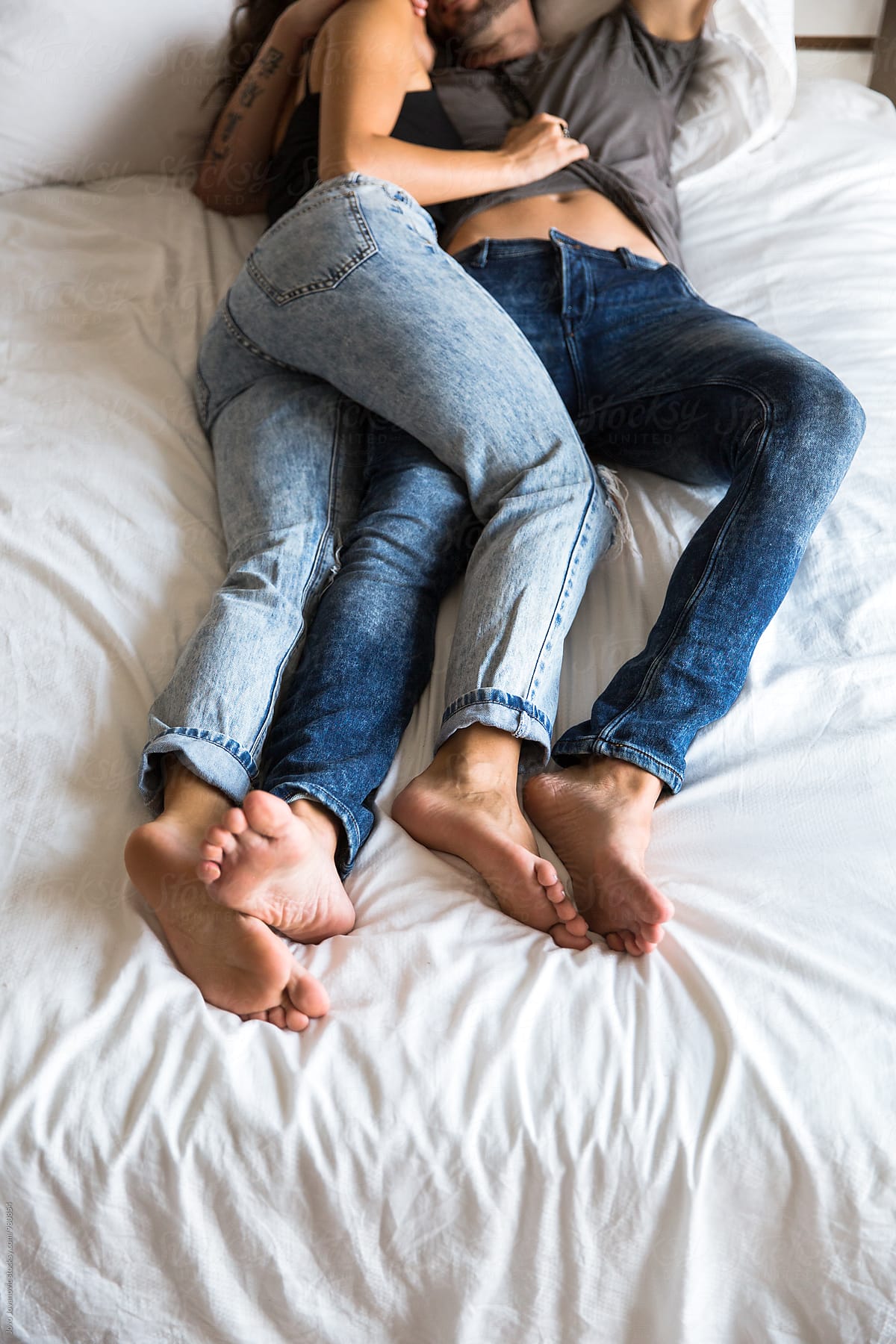 Couple In Bed Wearing Jeans By Stocksy Contributor Jovo Jovanovic Stocksy