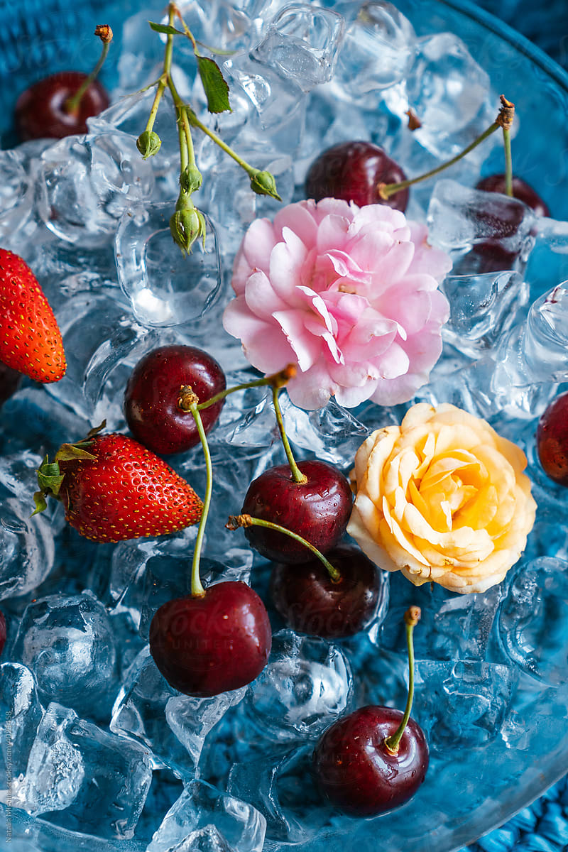 Berry and flowers on ice.