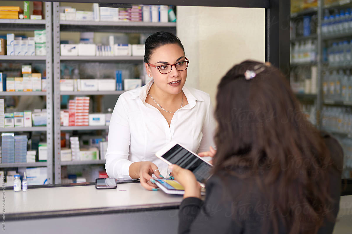 Pharmacy: Pharmacist sales rep using a tablet