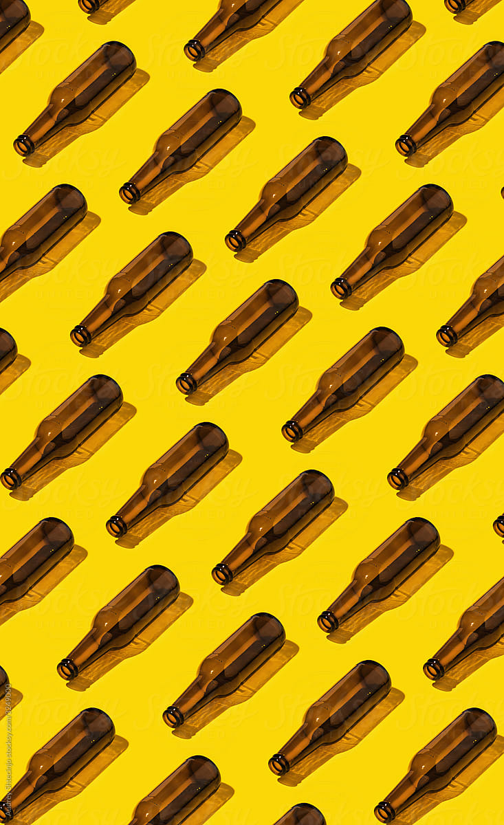 Beer Bottles On Yellow Background