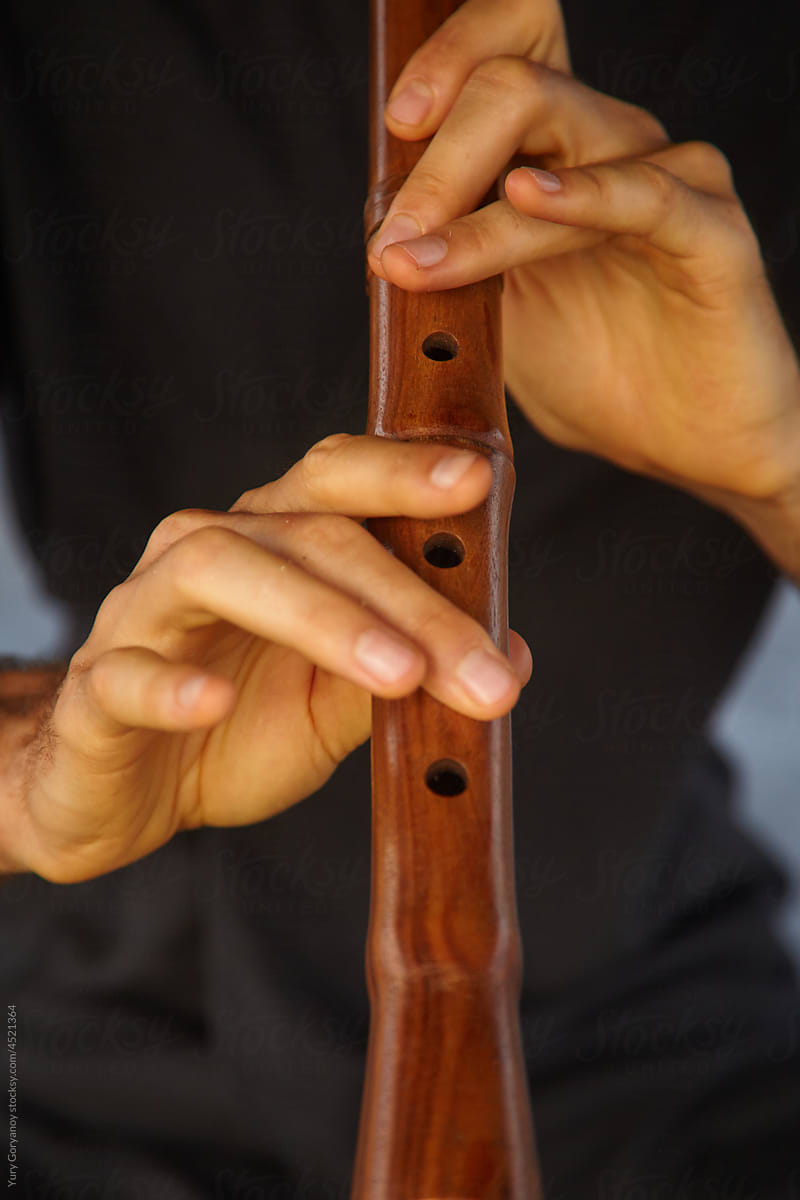 Fragment of playing the flute