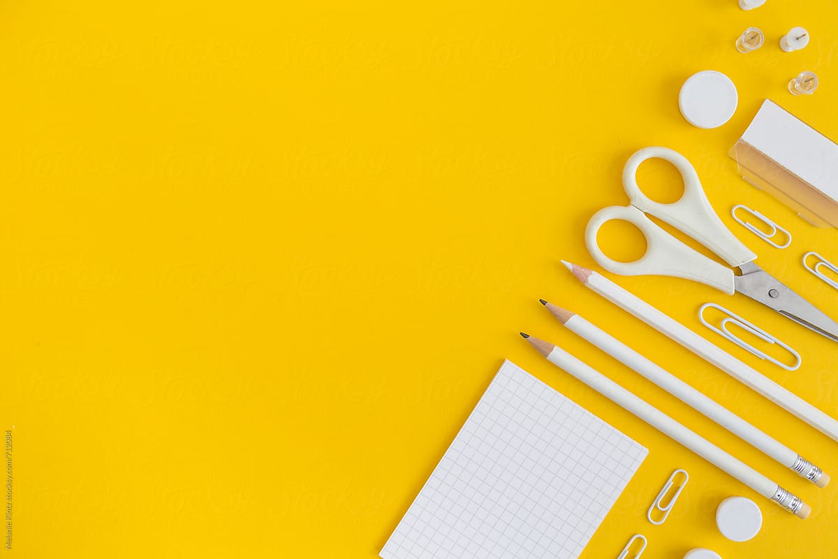 Yellow Office Utensils On A Grey Crafting Mat by Stocksy Contributor  Melanie Kintz - Stocksy
