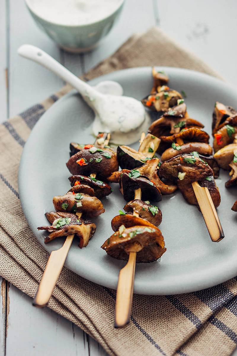 Food: grilled and marinated wild edible mushrooms with herbed sour cream