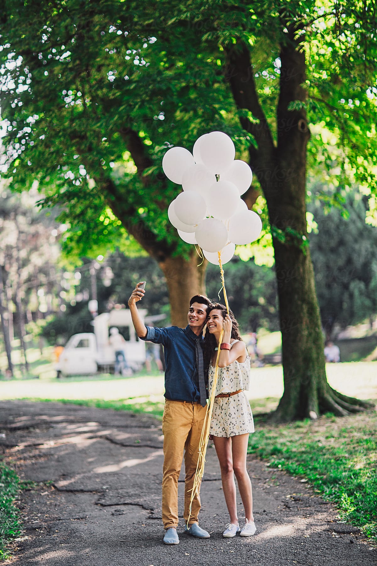Couple With Balloons Takes a Selfie