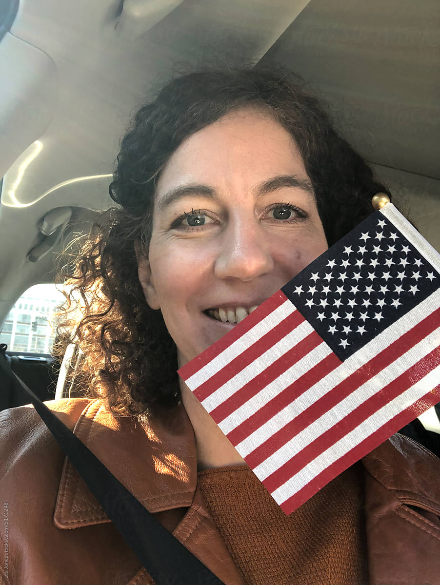 UGC selfie of happy woman with American flag