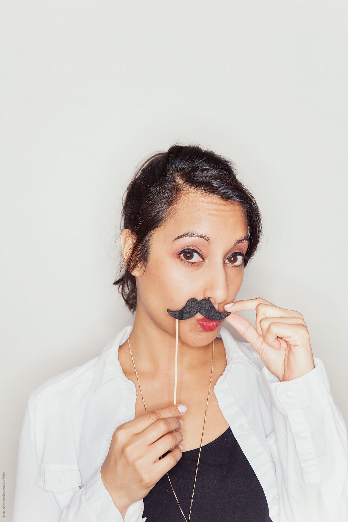 Portraits: Woman With Moustache On A Stick