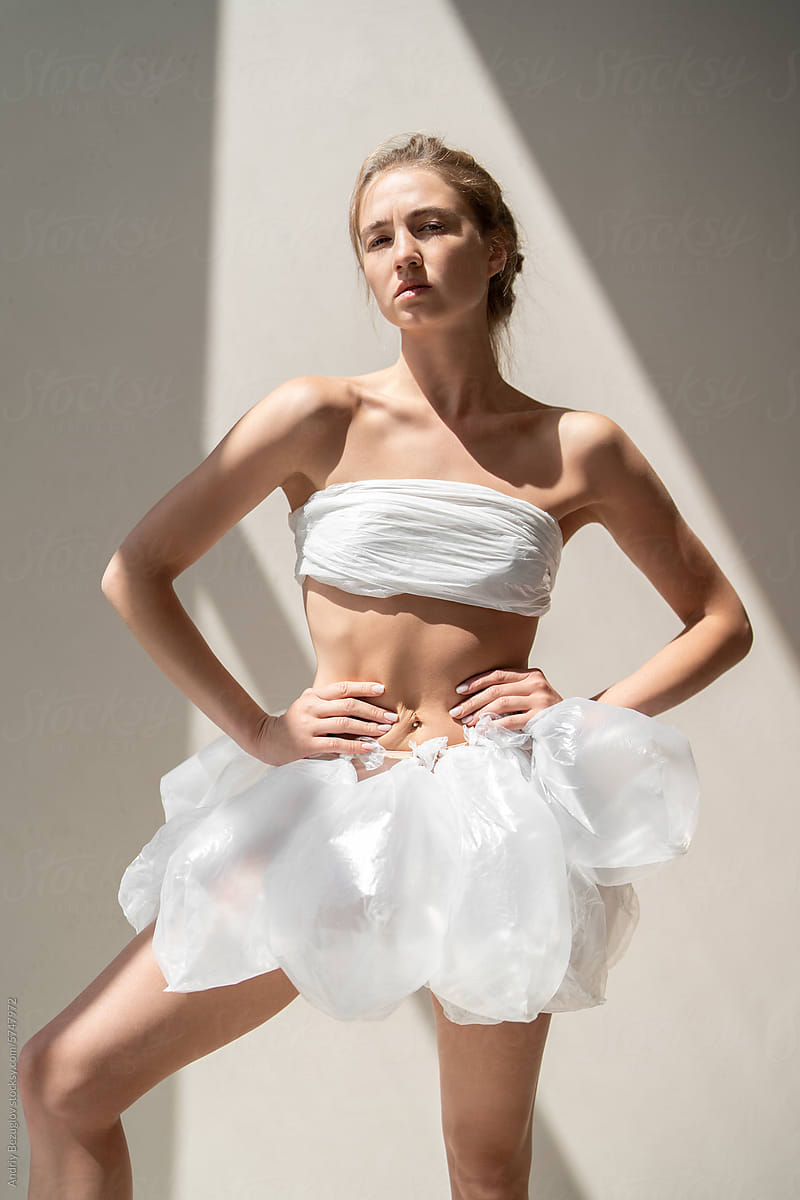 Ballet dancer in polyethylene wears which symbolizing ecological