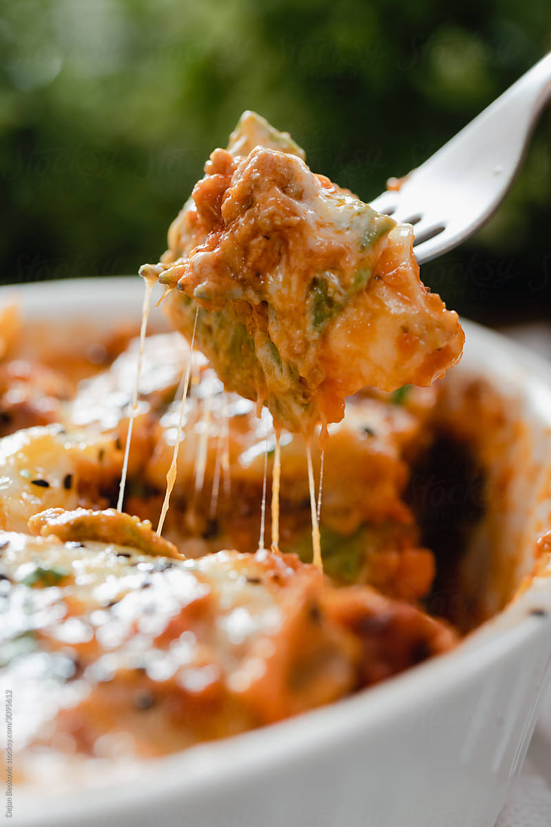Baked Lasagna In Sauce With Grated Cheese On Top.