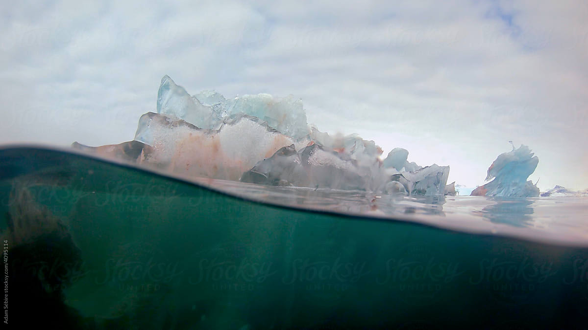 Translucent iceberg underwater meniscus, Arctic Greenland