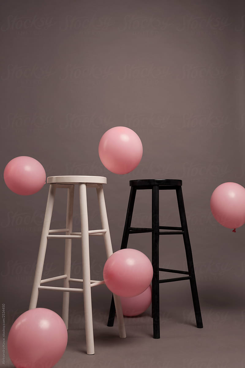 Party Pink Balloons and chairs on Grey Background