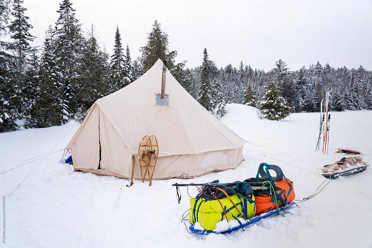 Winter Camping Gear with Canvas Tent Skis and Snowshoes