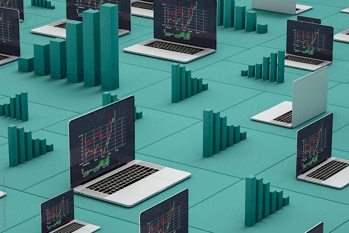 Laptops showing stock market statistics on screen