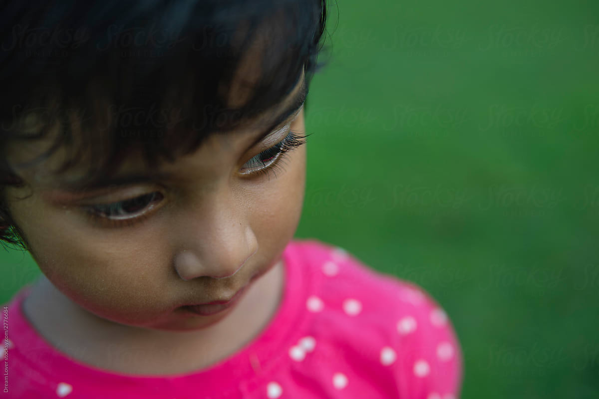 Little Indian girl with an orange garlan... | Stock Video | Pond5