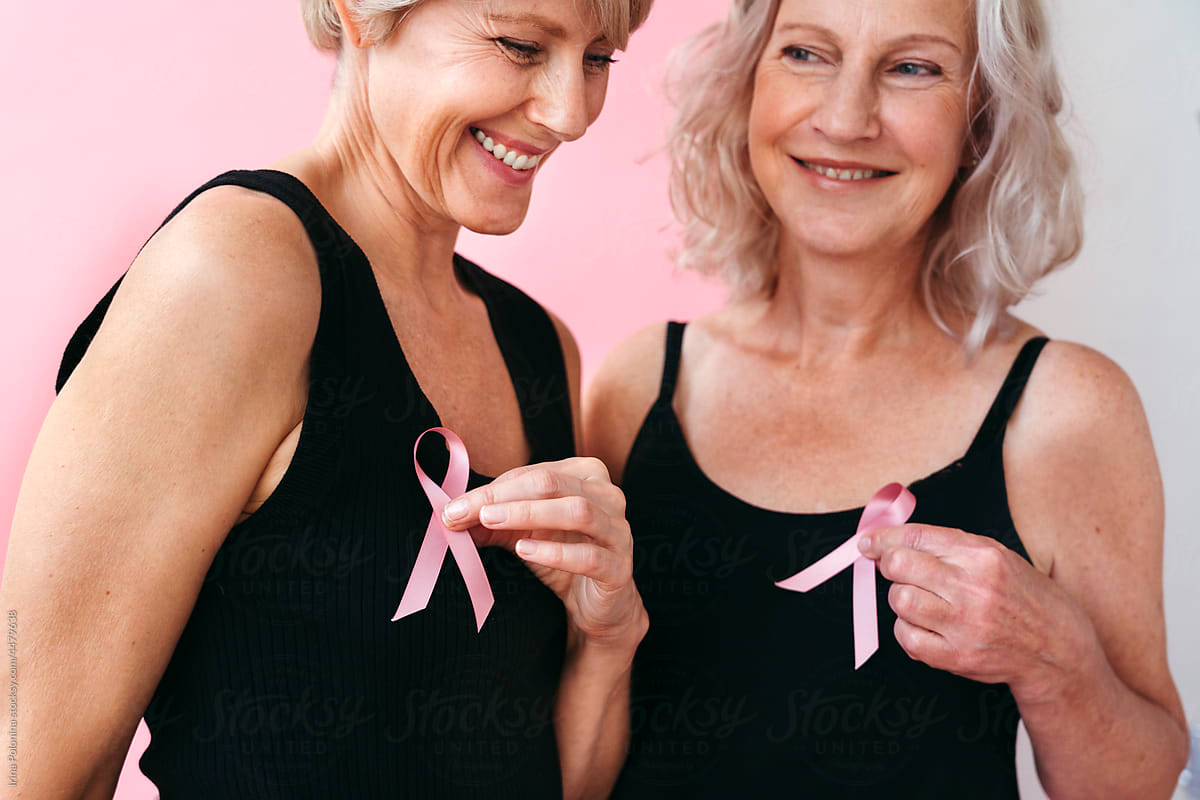 Positive women with pink ribbons.