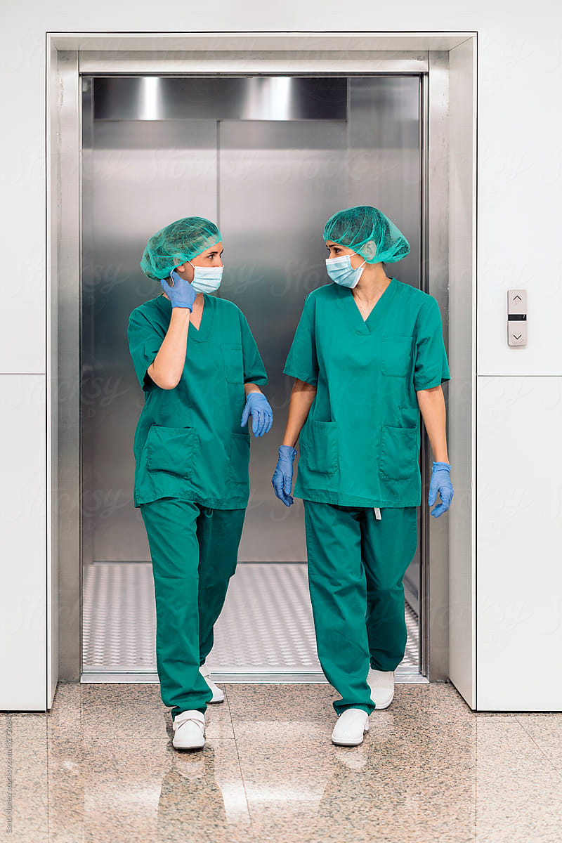 Medical Workers Getting Out of Elevator