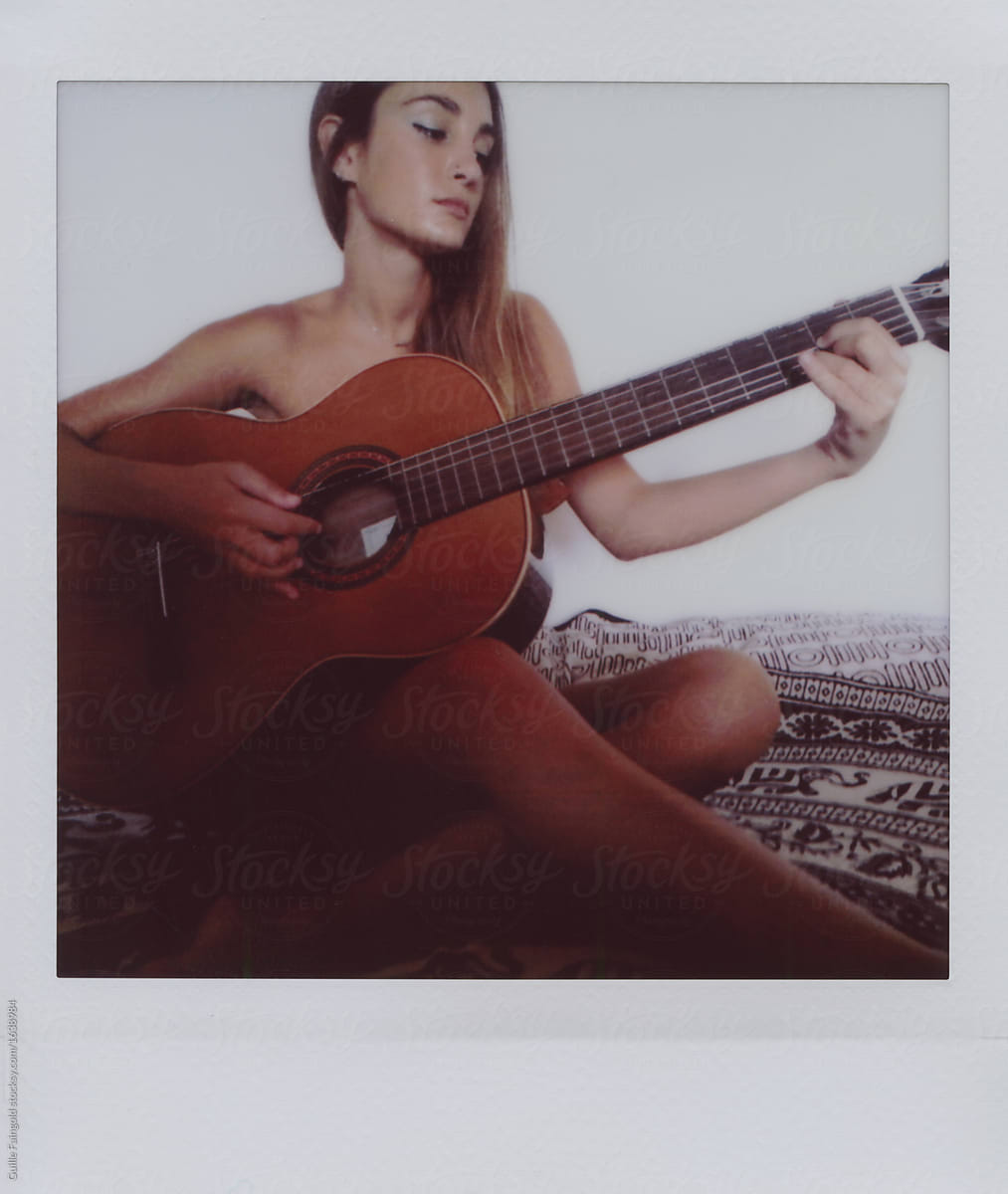 Naked Girl Playing The Guitar