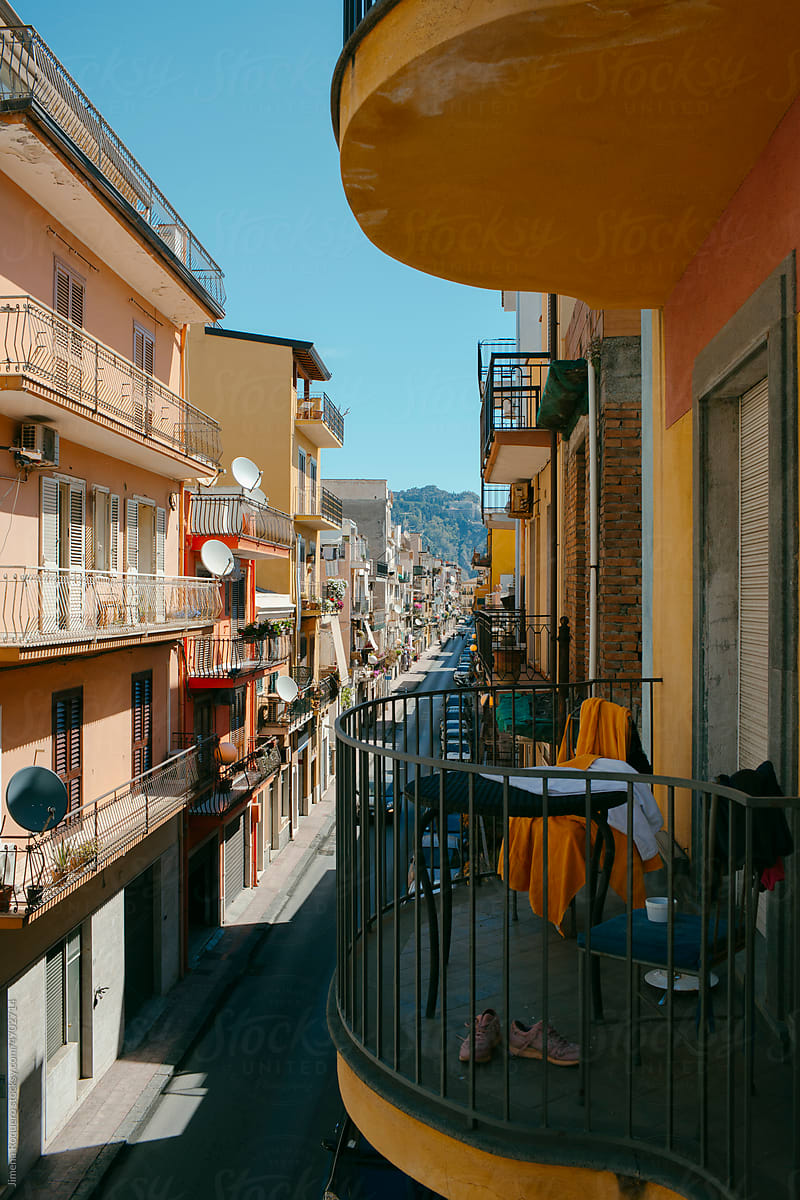 View of Sicilian street with the city of Taormina in the background