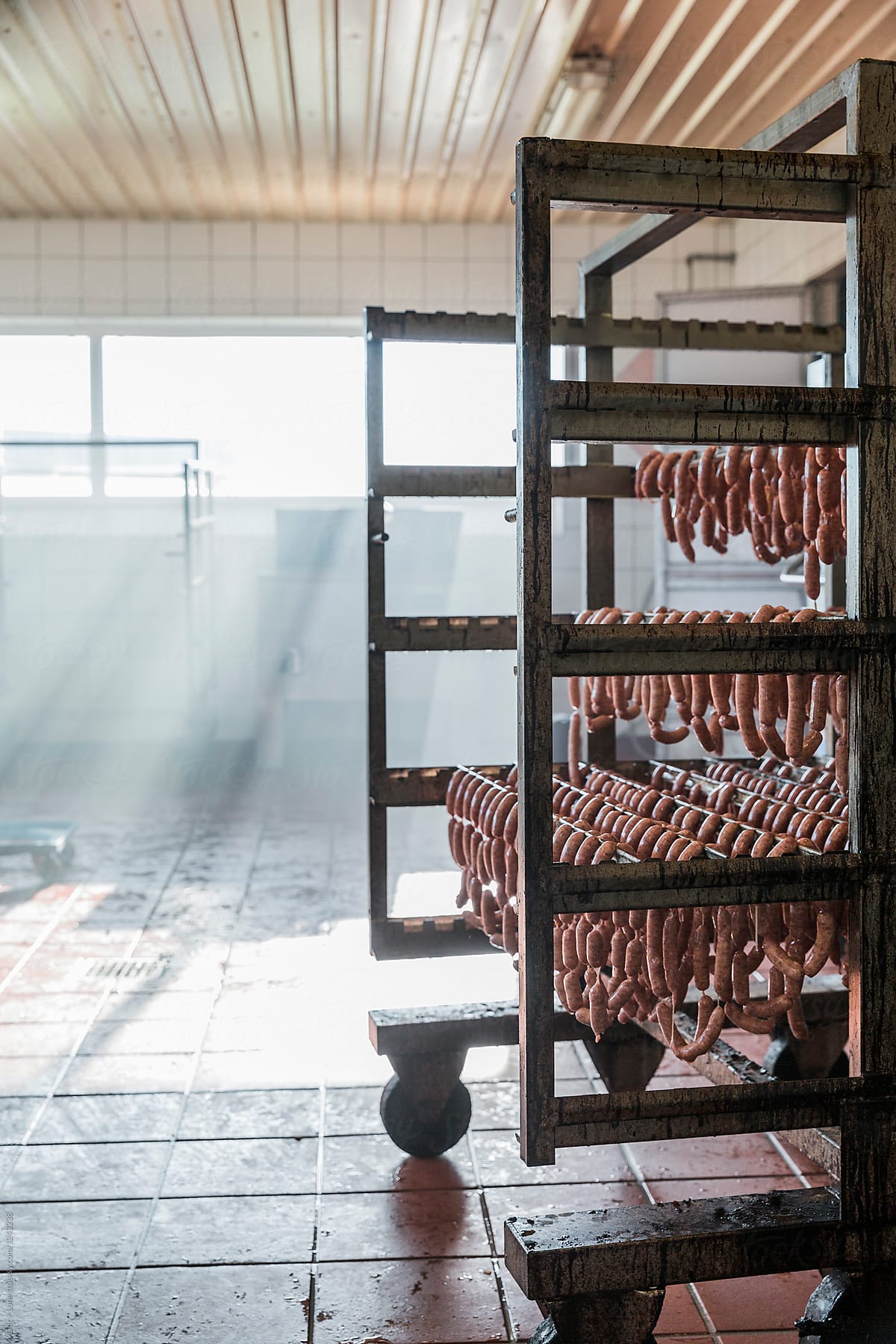 Rack with sausages hanging in a butcher shop