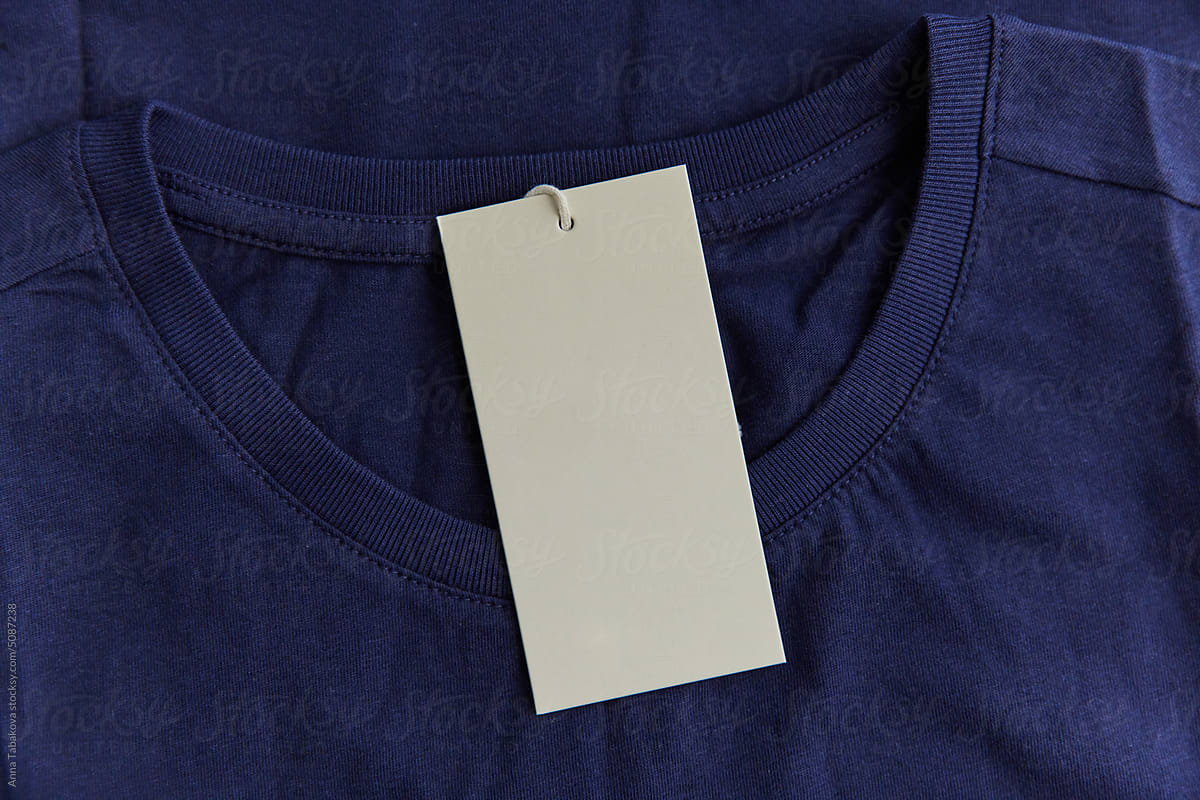 Blank  clothing label attached to blue tshirt