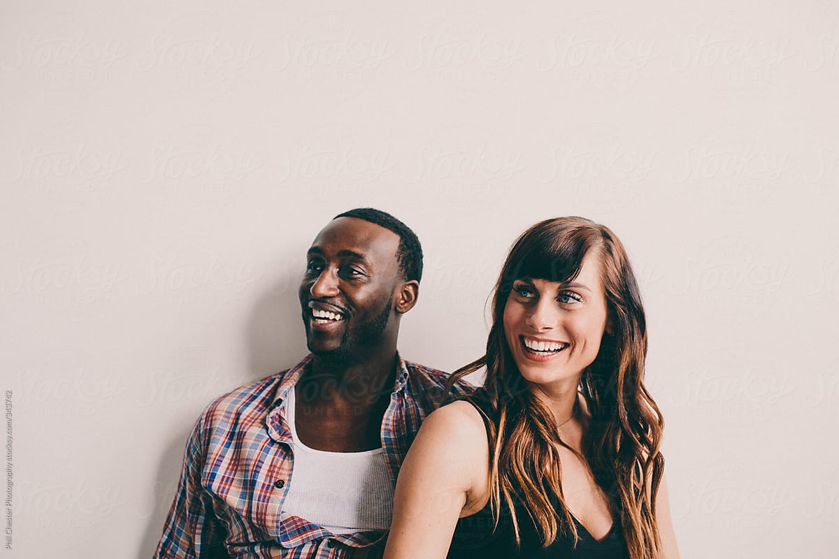 Cute Candid Of Interracial Couple Laughing By Phil Chester Photography Stocksy United