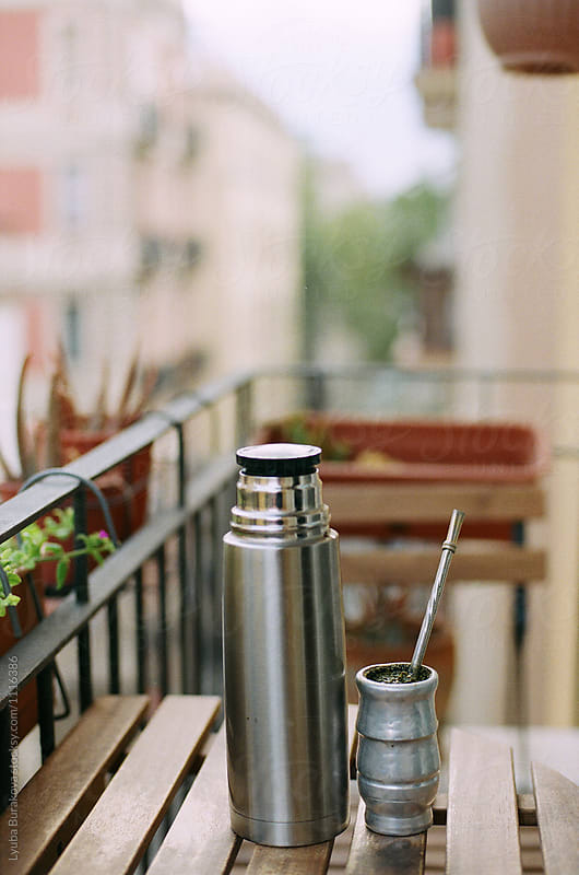 Drinking mate on a balcony