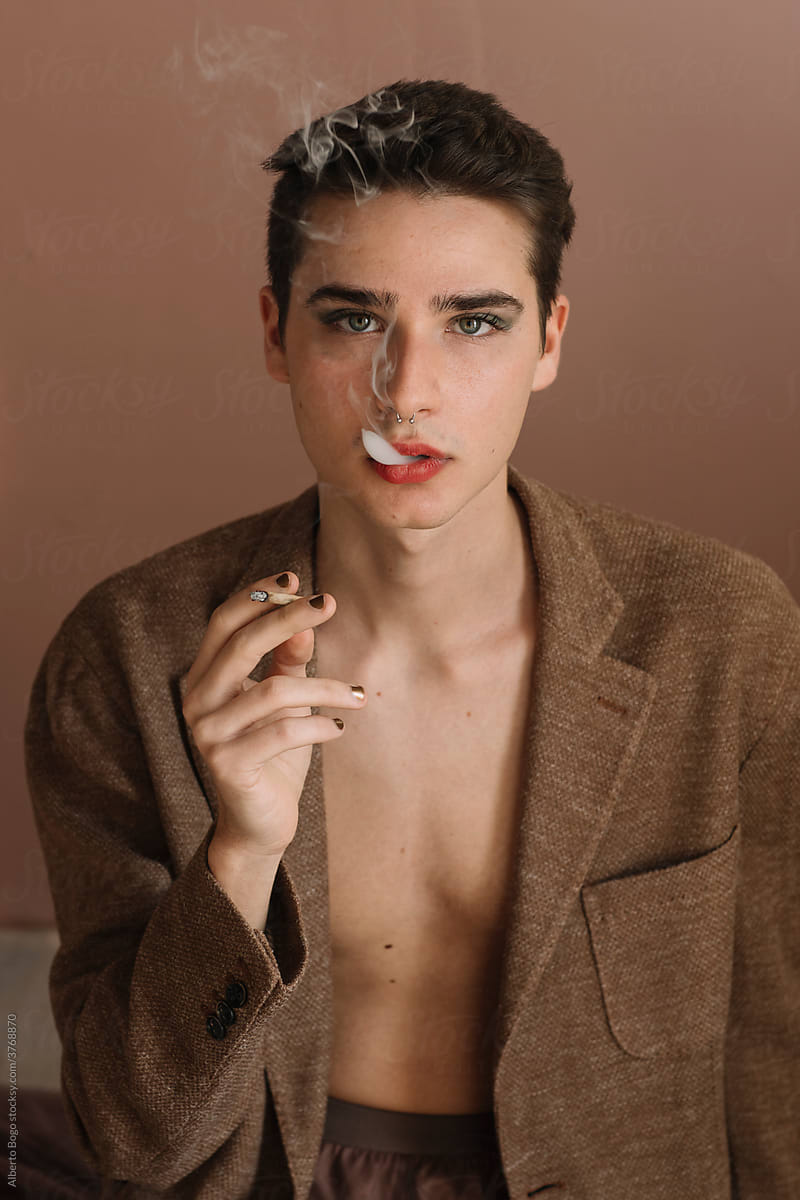 Non-binary Man With Makeup On Smoking