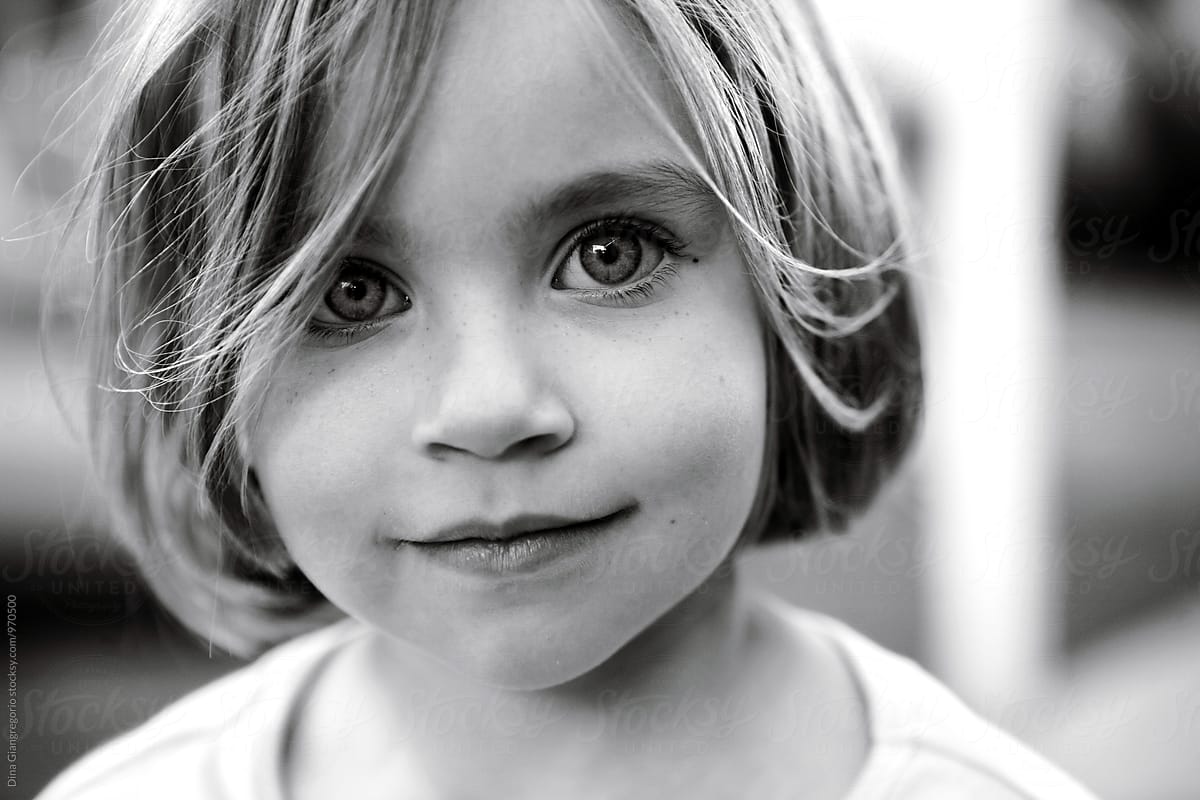 Portrait Of Little Smiling Girl Del Colaborador De Stocksy Dina
