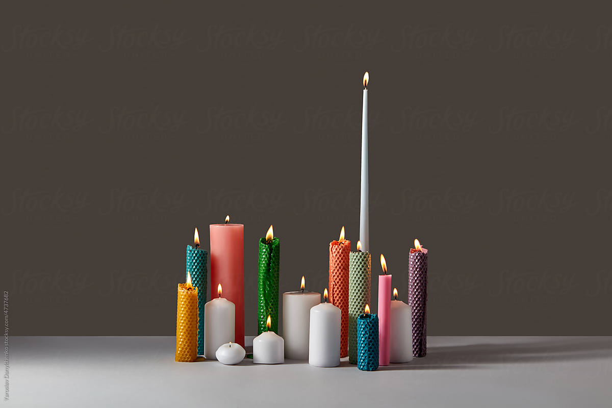 Handmade beeswax candles in various shapes.