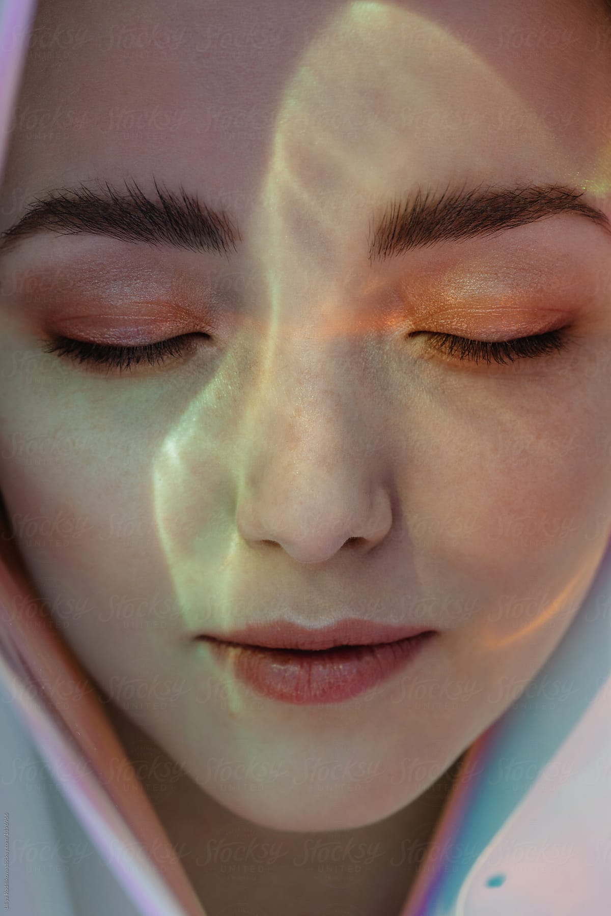 Surreal portrait of daydreaming girl with underwater lightning on her face