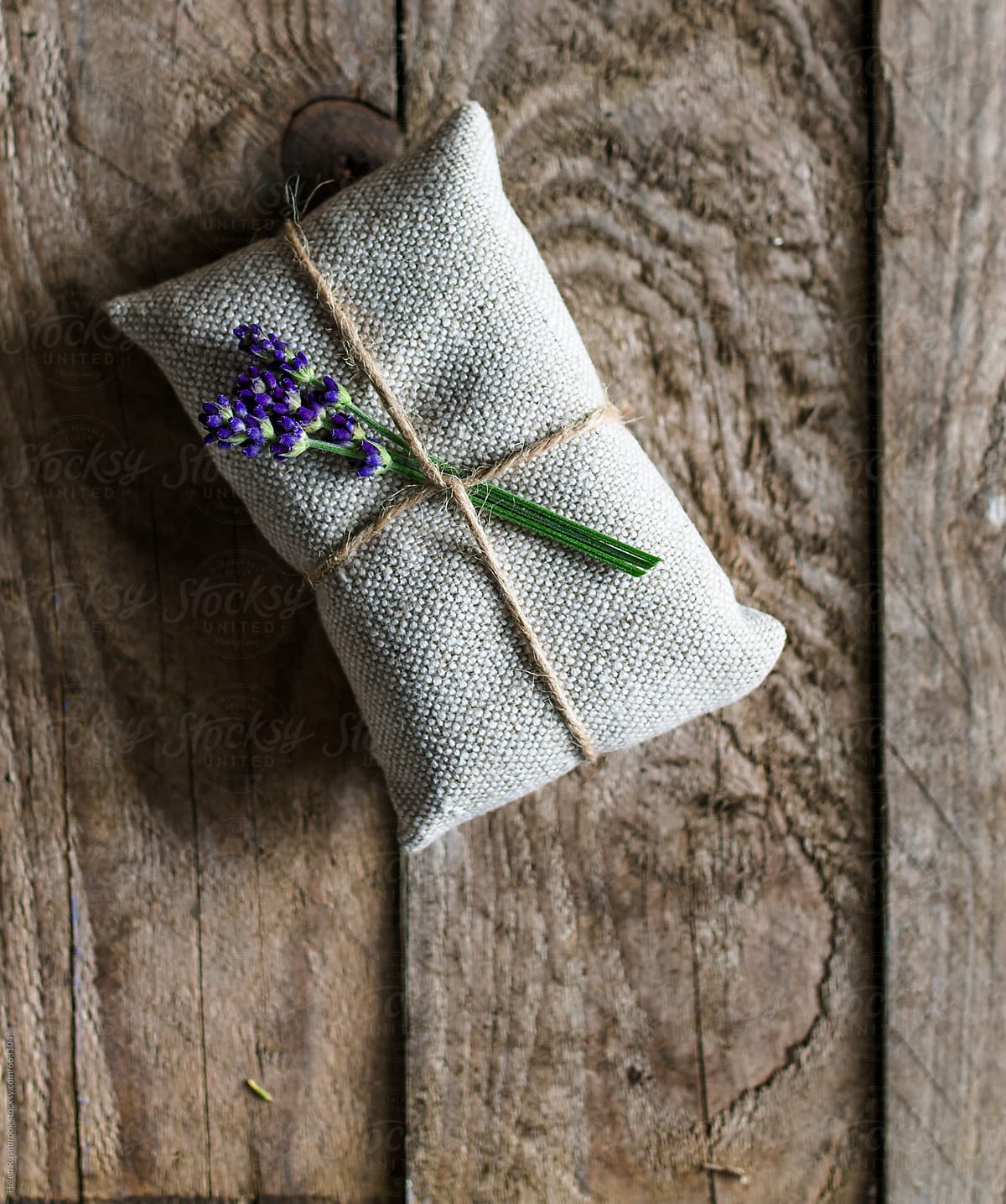 An object wrapped in natural materials with lavender