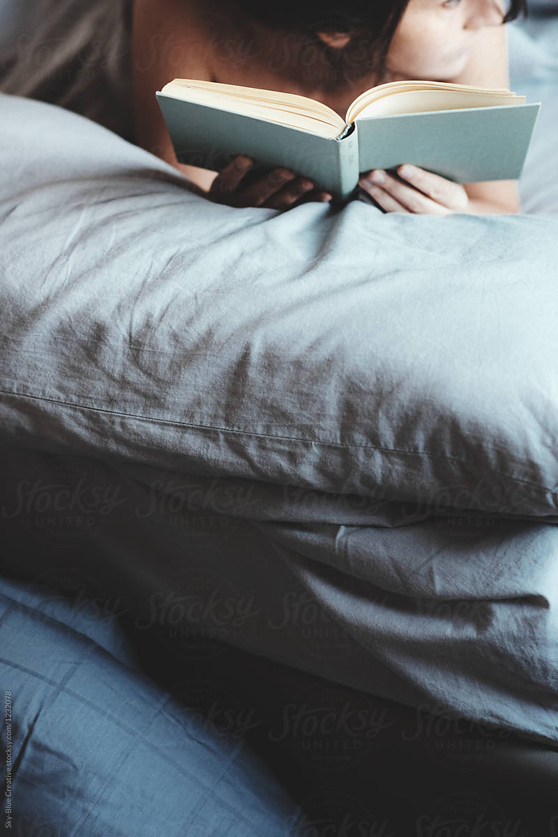 Woman Reading In Bed By Stocksy Contributor Sky Blue Creative Stocksy 