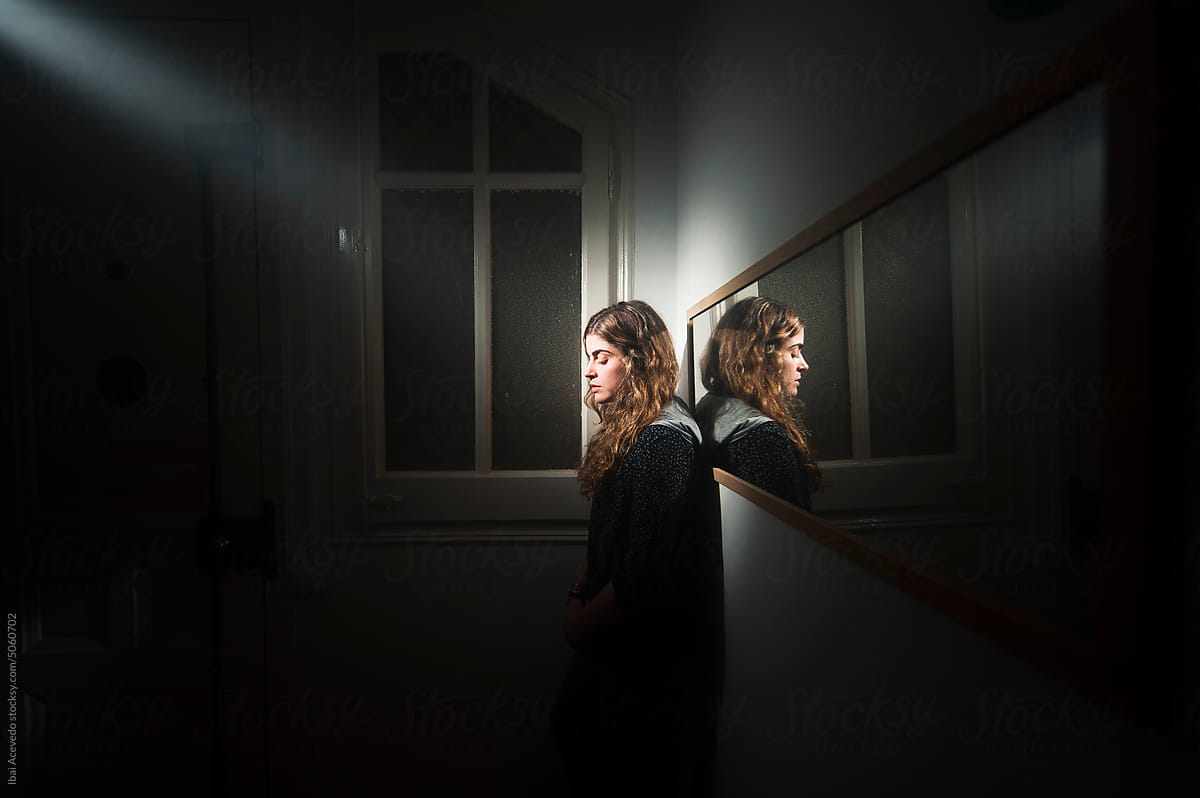 Surreal portrait of woman with spotlight