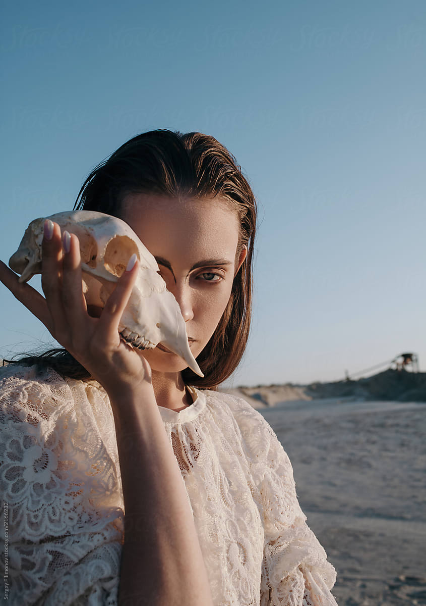 Gorgeous Model Posing With Skull By Stocksy Contributor Sergey