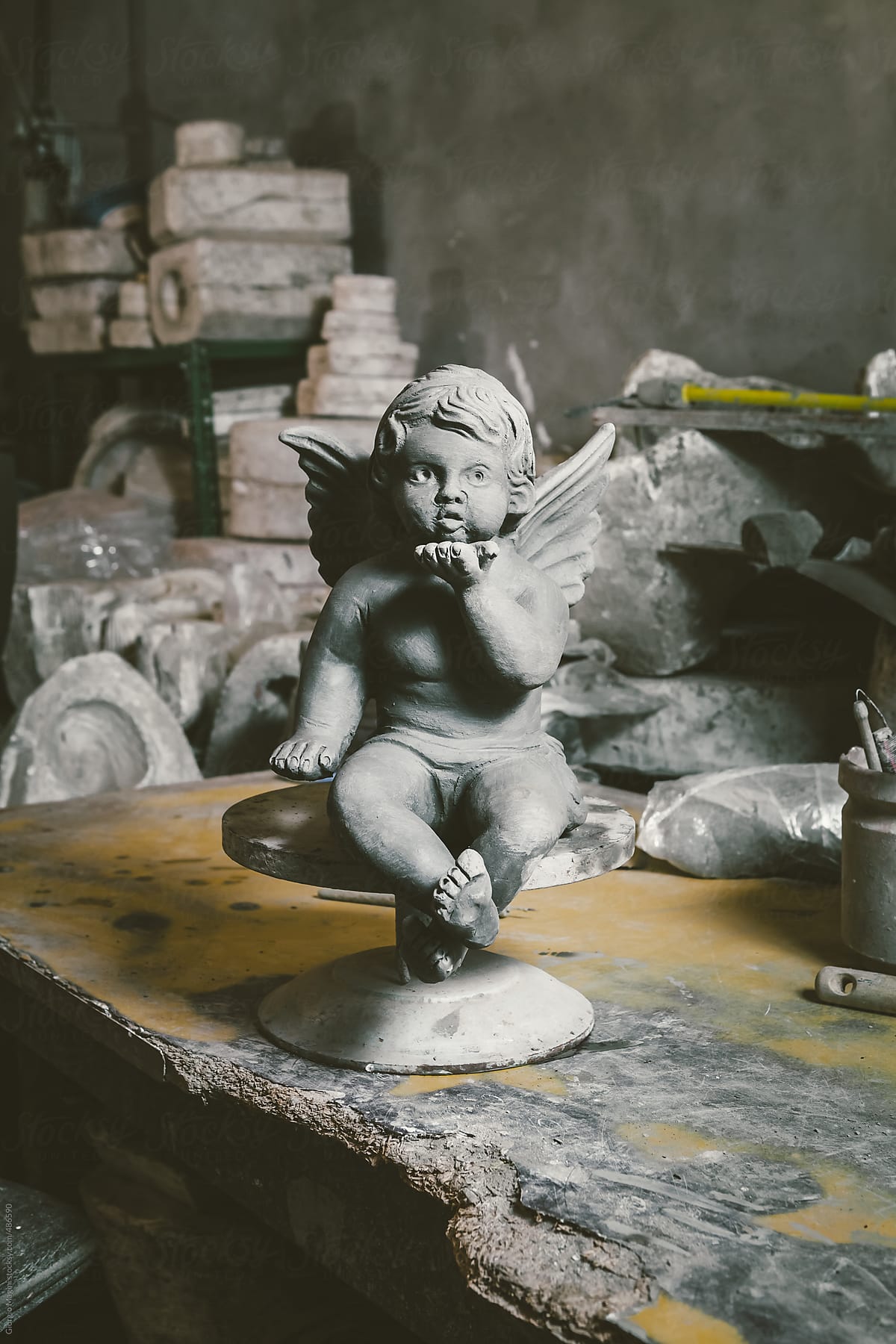 Terracotta Statue of a Little Angel in a Ceramics Studio