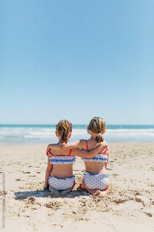 Little Sisters Having Fun at the Beach