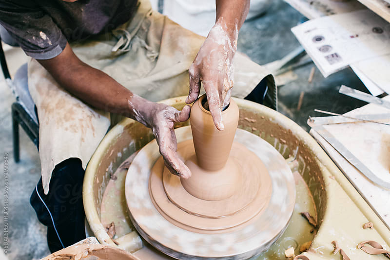 Anonymous Male Artisan Potter Making Vase on Flywheel
